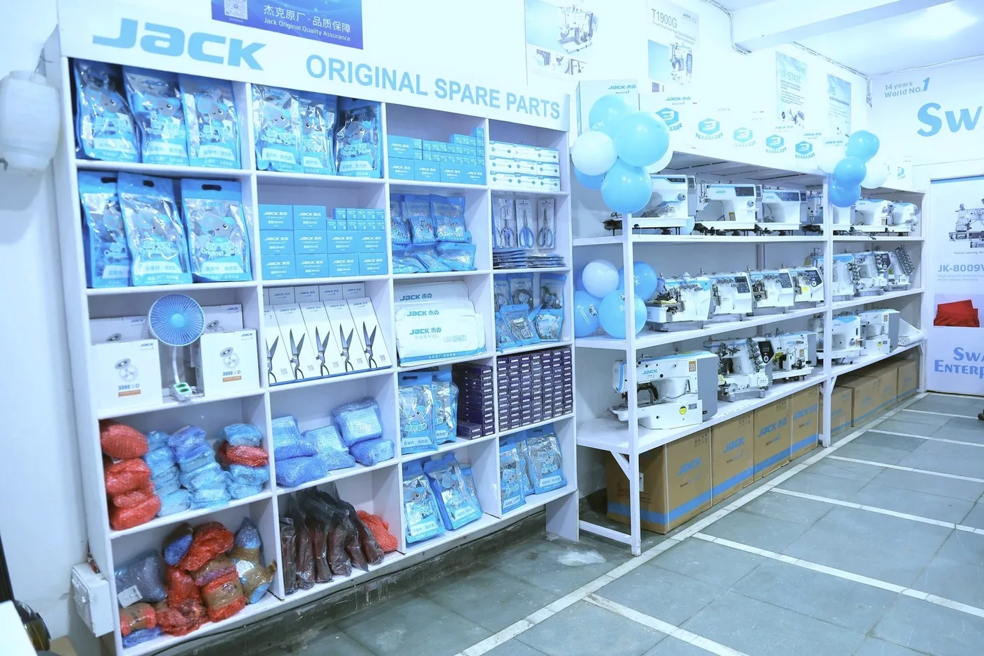 Inside the Swami Enterprises showroom: JACK original spare parts on shelves and JACK machines on display